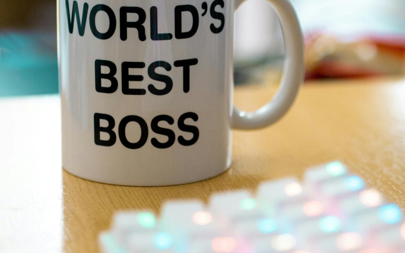 white mug on brown surface by Pablo Varela courtesy of Unsplash.