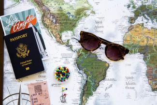 brown framed sunglasses on map by GeoJango Maps courtesy of Unsplash.